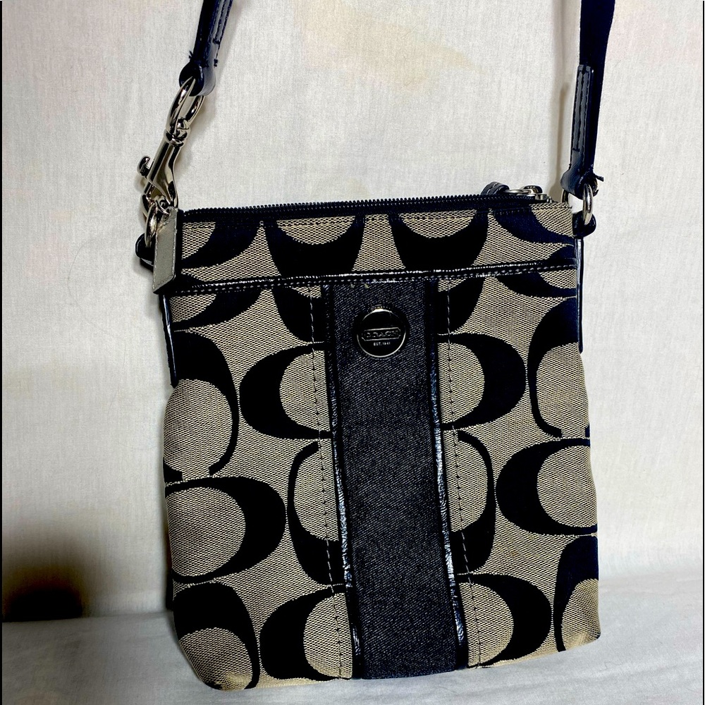 Cloth Coach cross body. No stains,rips,tears like new.